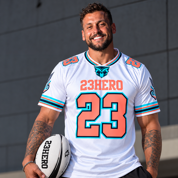 23HERO White NZ Rugby Jersey with coral and aqua number 23 worn by male model.